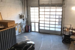 Sunset Self Storage (parking lot inside view with car)